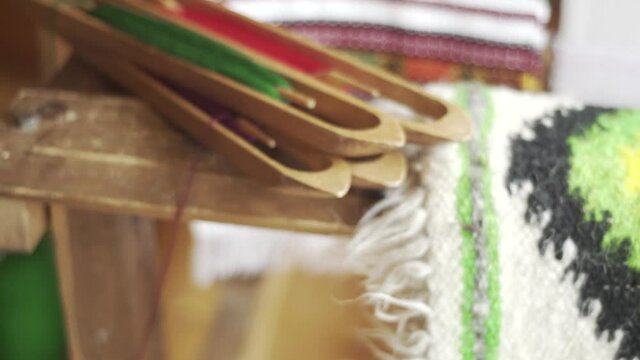 Authentic wooden spools with multicolored threads. Ukrainian folk Hutsul art