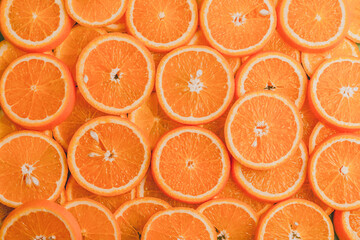 Texture of sliced orange, fresh and healthy fruit, which is rich in juice and vitamin c. Orange background.