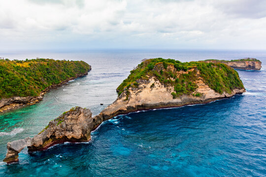 Beautiful sea beach Pantai Atuh under high cliffs. Nature, best travel destinations in Bali, Indonesia. Popular place to visit in Nusa Penida island