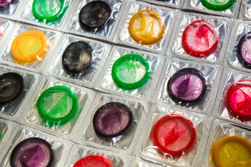 Colorful condoms background.