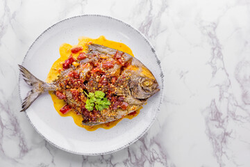 Deep fried pomfret fish and chili sauce