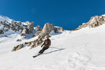 Skier on black slope in Valmorel, Tarentaise Valley, French Alps
