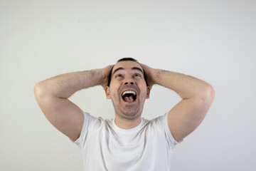 happy excited young man stand white background laugh hands up crazy look angry