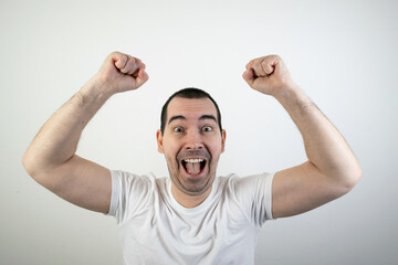 happy excited young man stand white background laugh hands up crazy look angry