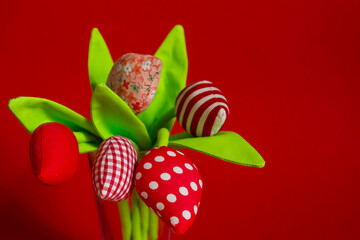 textile made by hand tulips tilde on a red background for text. Tilda toys. sewing for Valentine's Day and Women's Day. Spring background