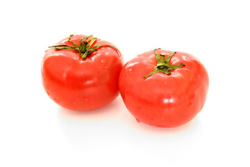Ripe and tasty Dagestan pink tomatoes with water droplets