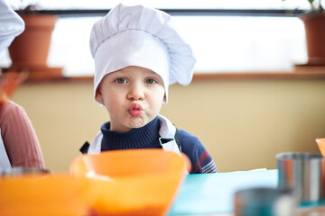 little child baking in the kitchen