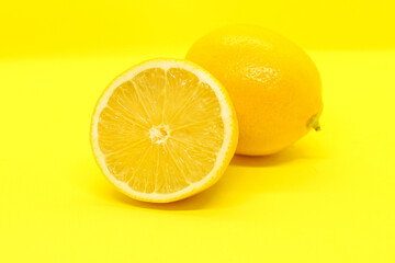 Sliced lemon on yellow background