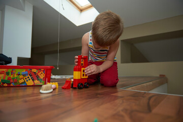 Little boy child playing with creative toys