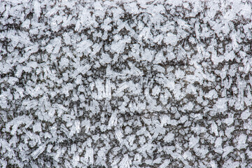 Ice crystal forming on a wooden deck.