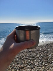 cup of coffee on the beach