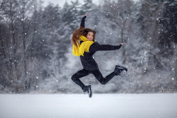 Girl jumping in the snow