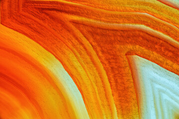 Cross section of natural translucent agate crystal surface, Orange abstract structure slice mineral...