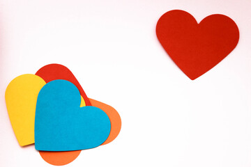 colorful heart shaped papers background for gay chat sites, love message background, top view.
