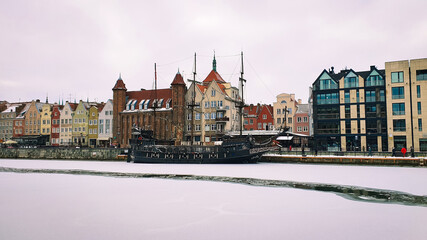 View of Gdansk old Town from the Motlawa River, Poland. Ancient European city. Winter scenery.