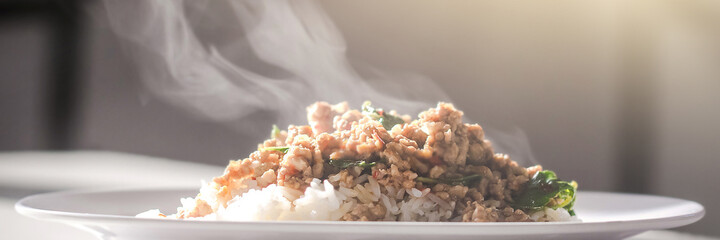 Stir-fried pork with basil on rice and fried egg.Thai traditional food style spicy.