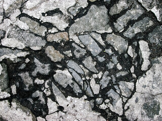 Cobblestone road surface. Old stone road. Broken stone effect.