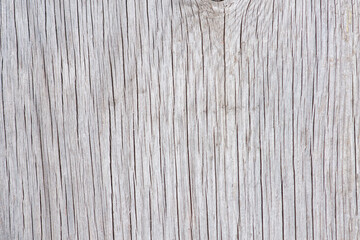 Old faded wood background with natural cracks.