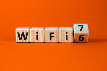WiFi 6 or 7 symbol. Turned a wooden cube and changed the words WiFi 6 to WiFi 7. Beautiful orange...