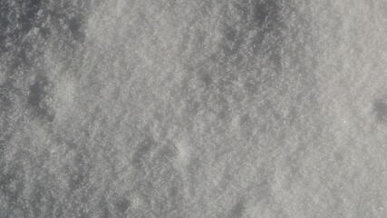 White real snow background. Closeup, top view