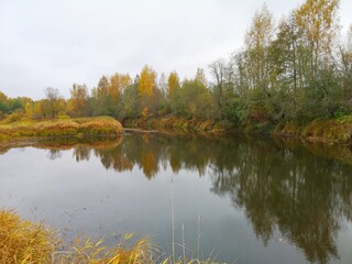 river in late autumn yellow and red leaves on the trees