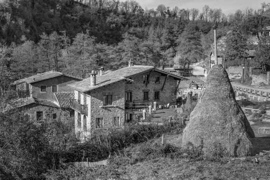 Traditional haystack on field in Rupit i Pruit, old medieval catalan village in Barcelona, Spain.Black and white vintage photography style.