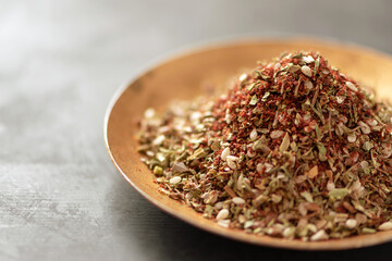 Zaatar is one of the most popular and beloved spices in Arabic cuisine. It is not only tasty, but also very healthy and is considered an aphrodisiac product. Selective focus.