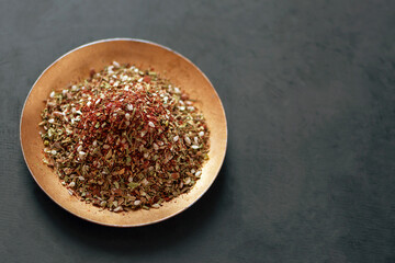 Zaatar is one of the most popular and beloved spices in Arabic cuisine. It is not only tasty, but also very healthy and is considered an aphrodisiac product. Selective focus.