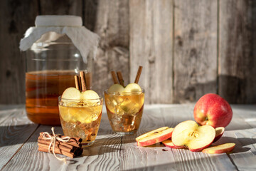 Kombucha cocktail with apples and cinnamon. It is a fermented beverage. Not only does it have the...