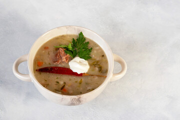 Rassolnik - a dish of Russian cuisine, a soup with meat broth, the basis of which is pickled cucumbers, barley, potatoes, herbs and sour cream can also be.