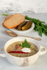 Rassolnik - a dish of Russian cuisine, a soup with meat broth, the basis of which is pickled cucumbers, barley, potatoes, herbs and sour cream can also be.