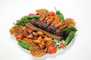 turkish mix kebab with adana kebab, aubergine kebab, chicken wings, grilled chicken shish, lamb shish kebab