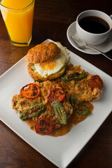 Chicken fried steak. Flank steak battered & deep fried in cast iron skillet. Classic American southern, low country cuisine. Made from scratch chicken fried steak served with gravy and side dishes.