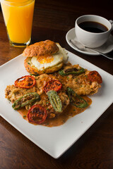 Chicken fried steak. Flank steak battered & deep fried in cast iron skillet. Classic American southern, low country cuisine. Made from scratch chicken fried steak served with gravy and side dishes.
