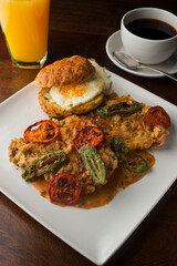 Chicken fried steak. Flank steak battered & deep fried in cast iron skillet. Classic American southern, low country cuisine. Made from scratch chicken fried steak served with gravy and side dishes.