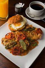 Chicken fried steak. Flank steak battered & deep fried in cast iron skillet. Classic American southern, low country cuisine. Made from scratch chicken fried steak served with gravy and side dishes.
