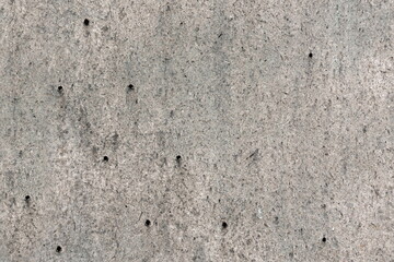 Dark Grey Exposed Concrete Wall With Screw Holes Material.