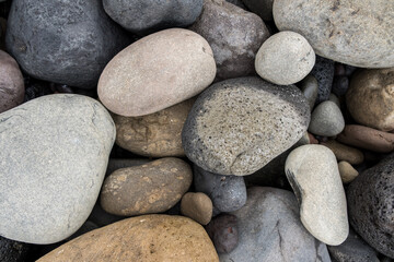 Fototapeta na wymiar Volcanic sea stones, gravel. Background. Textures