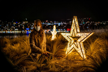 girl with mask in the night near a star