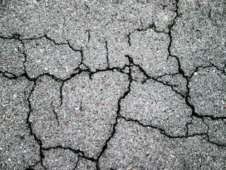 Asphalt texture. Damage road construction.