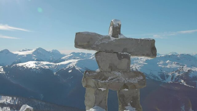 Whistler, British Columbia, Canada. Beautiful View of Statue on top of Blackcomb Mountain with the Canadian Snow Covered Landscape in background during a cloudy and vibrant winter day.