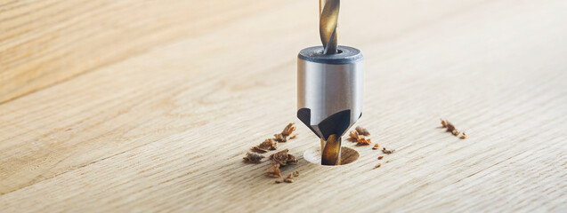 Countersink drill bit make sink in hole for screw in wooden oak plank