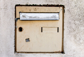 mailbox embedded in a concrete wall