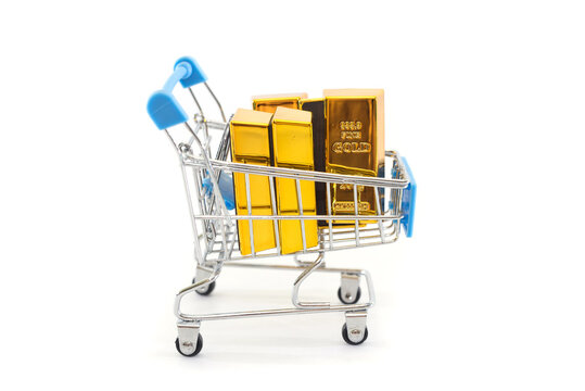 Gold Bars In A Shopping Cart Isolated On White