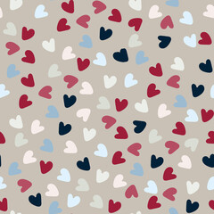 Seamless pattern. Hand drawn multicolored heart shapes on beige background, for wrapping paper and other design projects. Valentines Day concept, love, romance concept