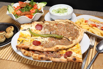 turkish mixed pitta with minced meat, cheddar cheese, chopped meat and sudjuk