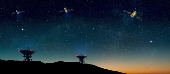 Obraz na płótnie Canvas Landscape with radio telescopes on ground and satellites in starry night sky - 3d Illustration