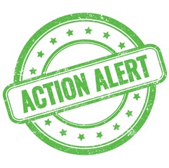 ACTION ALERT text on green grungy round rubber stamp.