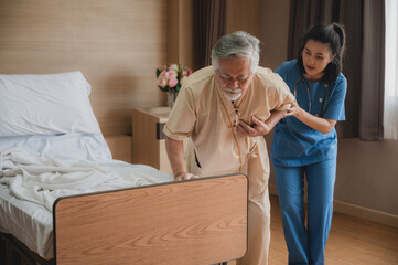 Nurses support the elderly patient man to resting at hospital room, medical health care and old...