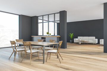 Grey and wooden living room with chairs and table, sofa and window